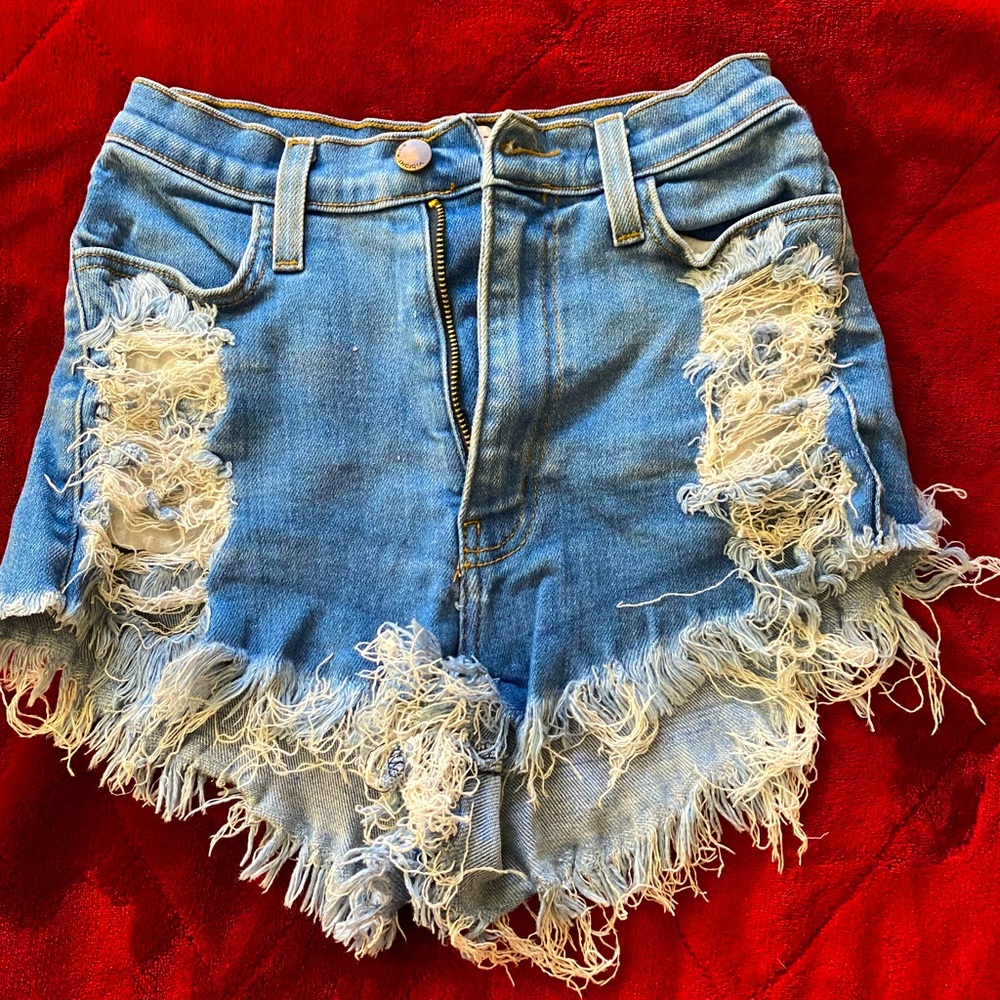 High waisted medium wash ripped jeans short